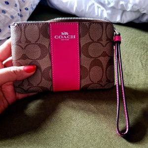 Coach monogrammed fuchsia wristlet